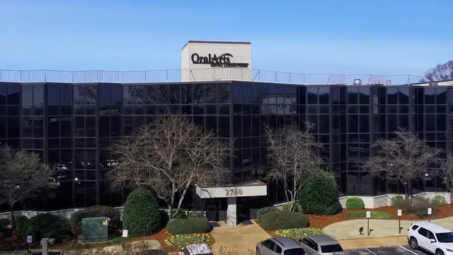 The Oral Arts Dental Lab building, with its sign on the roof.