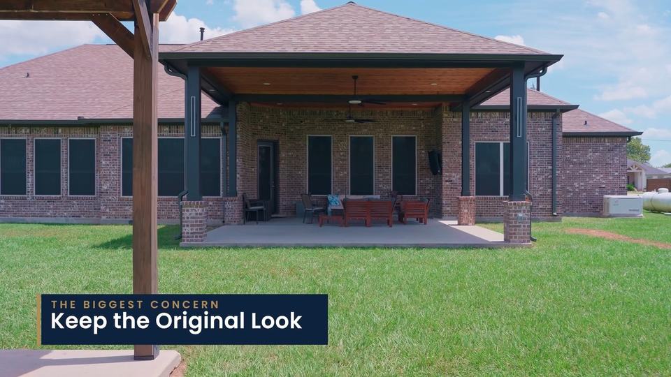 A covered patio on the back of a brick home, seen from the lawn. On-screen label: “The biggest concern: Keep the Original Look.”