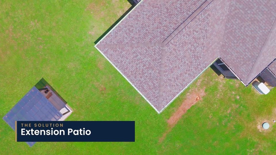 Overhead view of a house roof beside a new patio roof. On-screen label: “The solution: Extension Patio.”